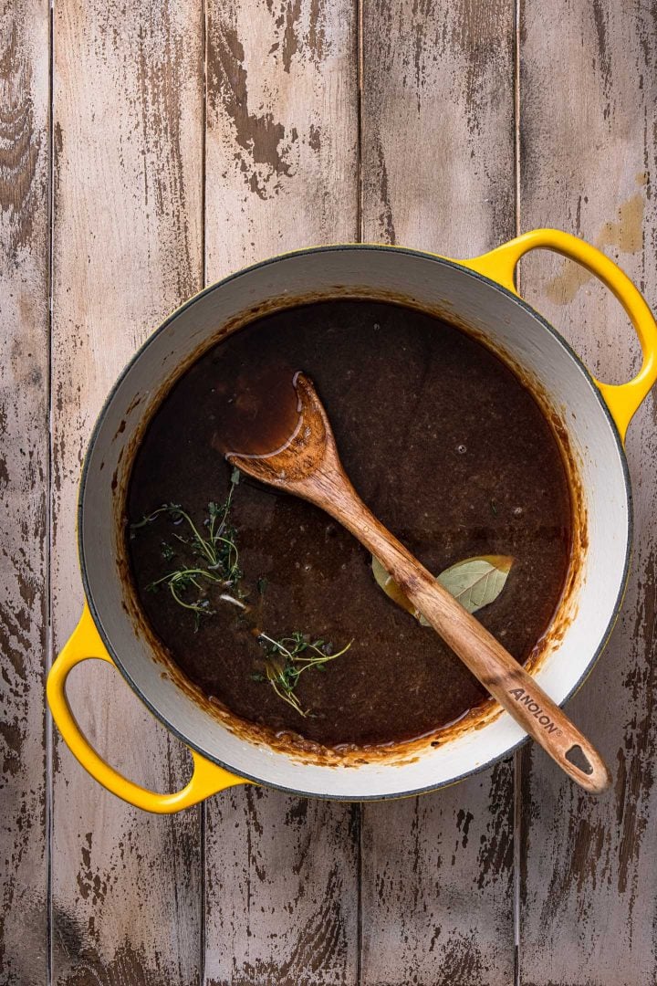 A pot of French Onion Soup, before simmering.