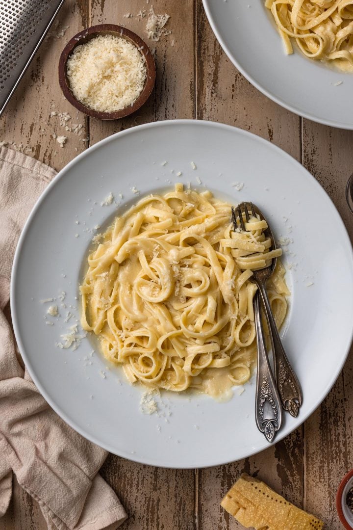 An overhead photo of a bowl of creamy fettuccine Alfredo.