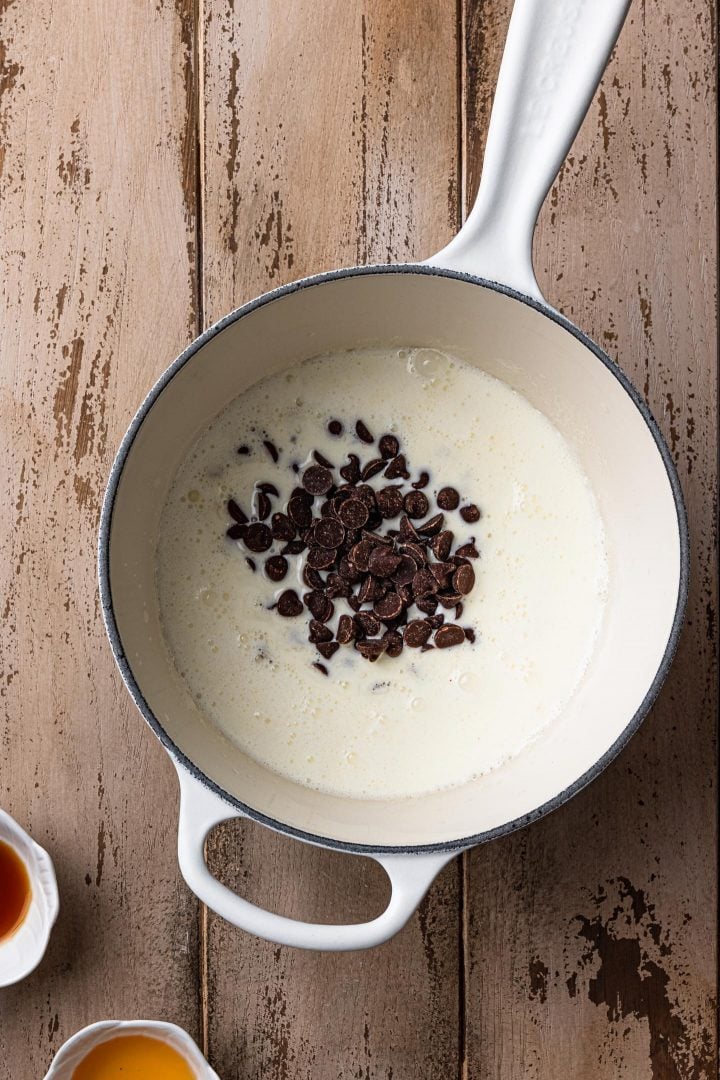 Chocolate chips melting in the heavy cream.