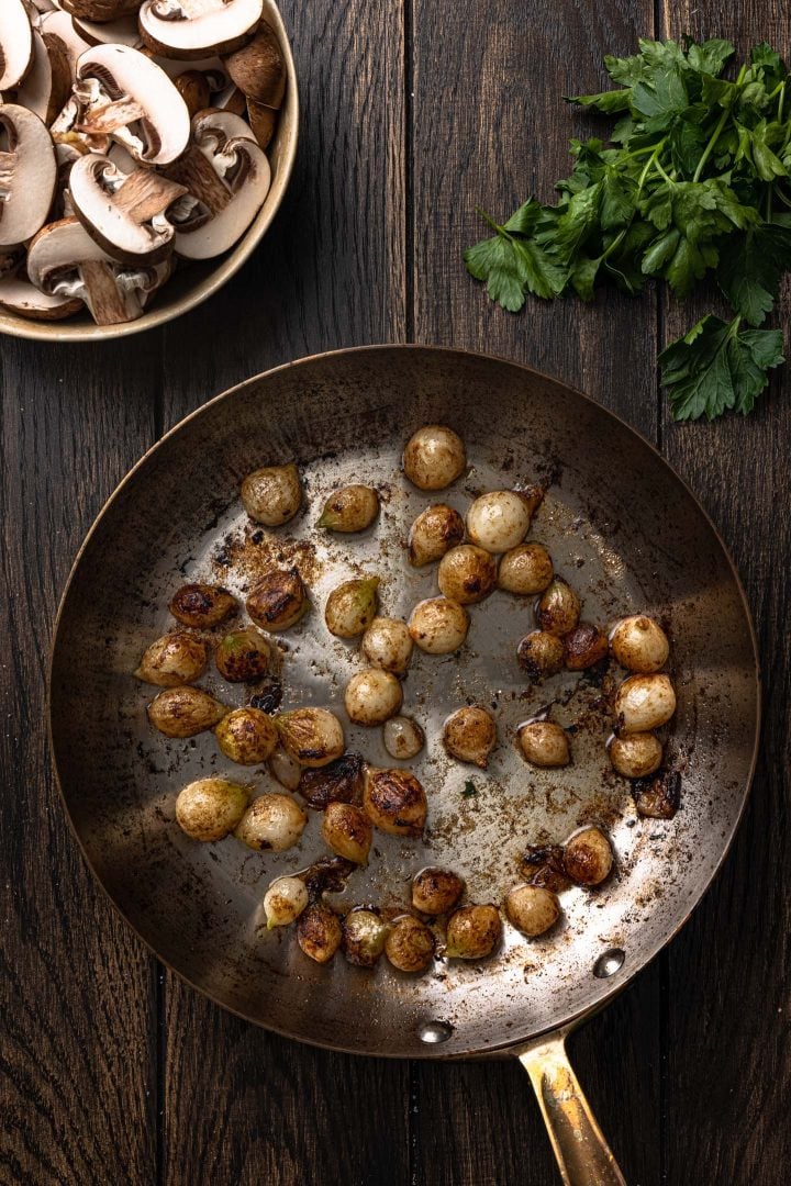 Browned pearl onion on skillet.