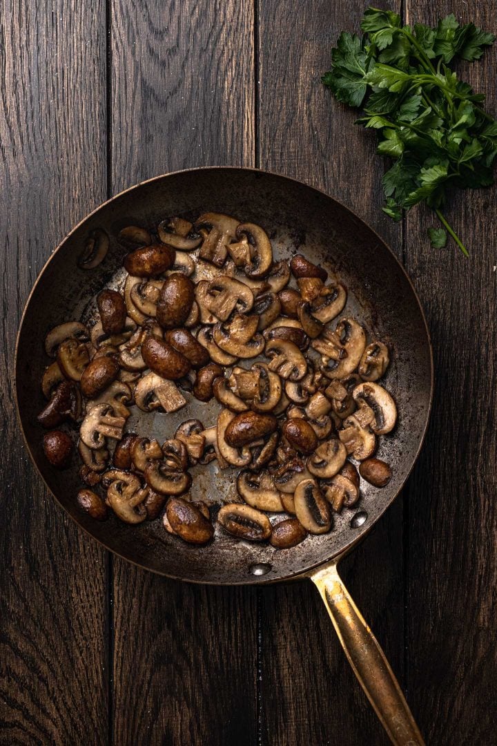 Browned mushrooms on skillet.