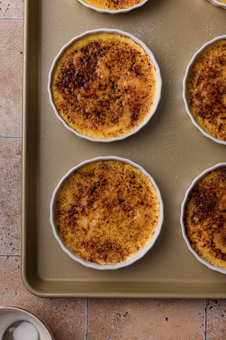 The ramekins in a baking sheet.