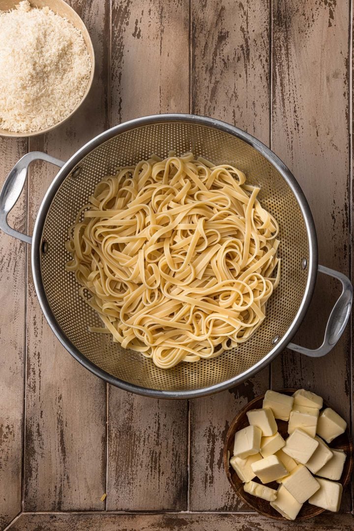 Pasta draining in colander.