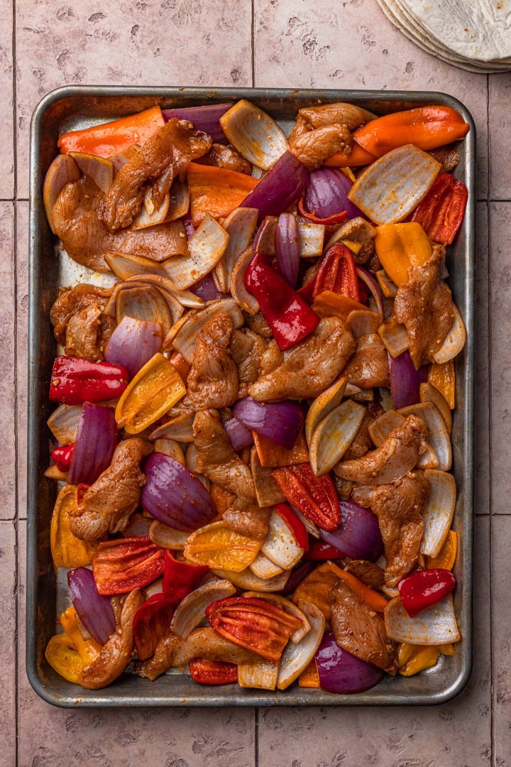 The marinated ingredients in a sheet pan.