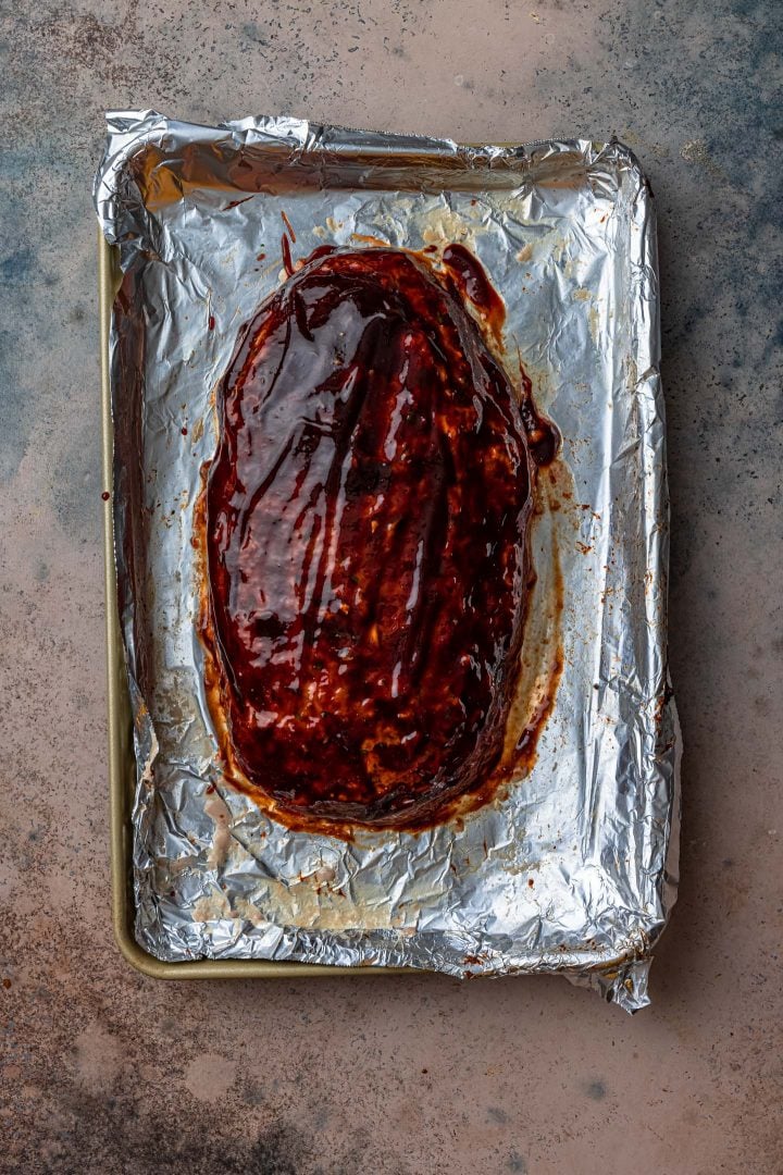 Applying the glaze to the loaf.