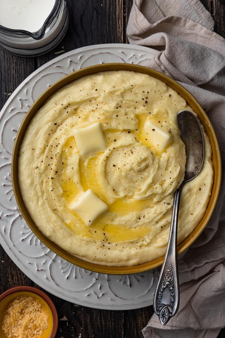 An overhead photo of a bowl of smoked gouda cheesy mashed potatoes.