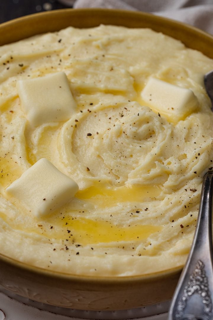 A close up of cheesy mashed potatoes.