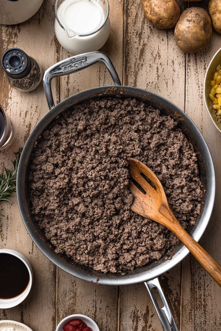 Browning ground beef in a sauté pan.