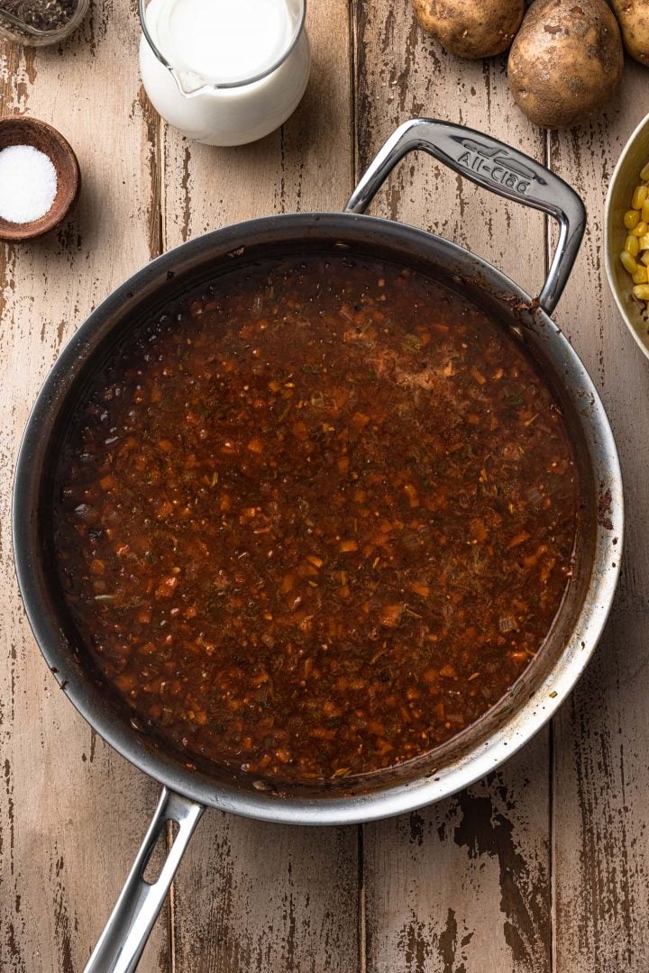 Preparing the gravy in a sauté pan.