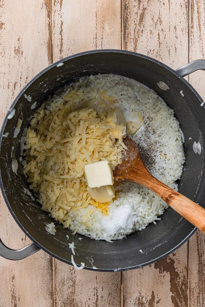 Mixing all the ingredients to make mashed potatoes.