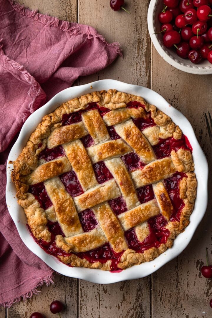 A close up of a freshly baked cherry pie.