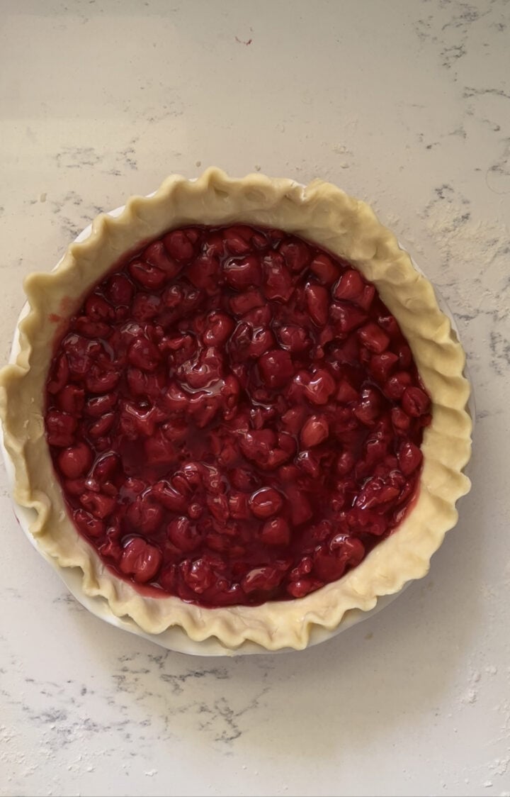 Cherry filling in pie dish.