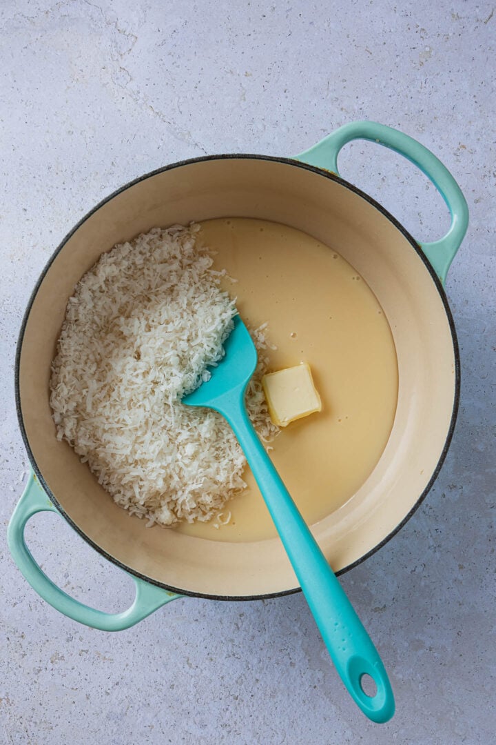 The ingredients in a Dutch Oven, with a spatula.