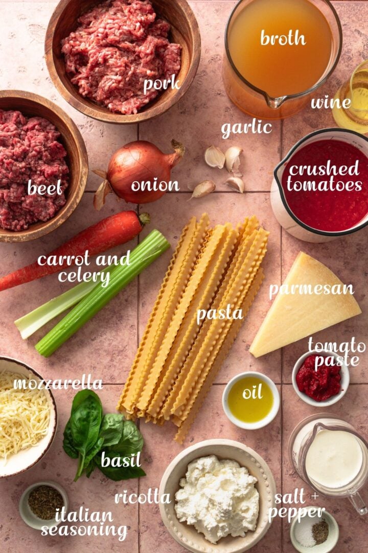 Ingredients for creamy lasagna soup including ground meat, tomatoes, pasta, and cheeses.