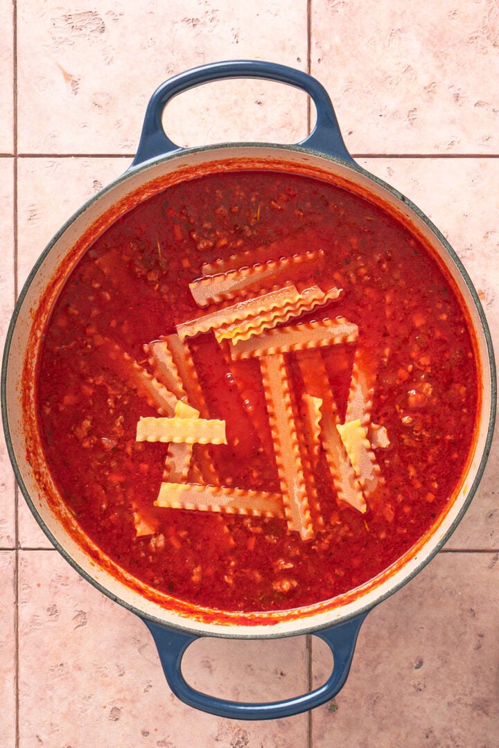 Mafaldine pasta added to soup and cooking in broth