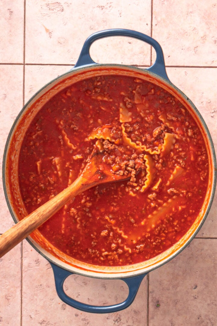 Pasta softening in lasagna soup as it cooks