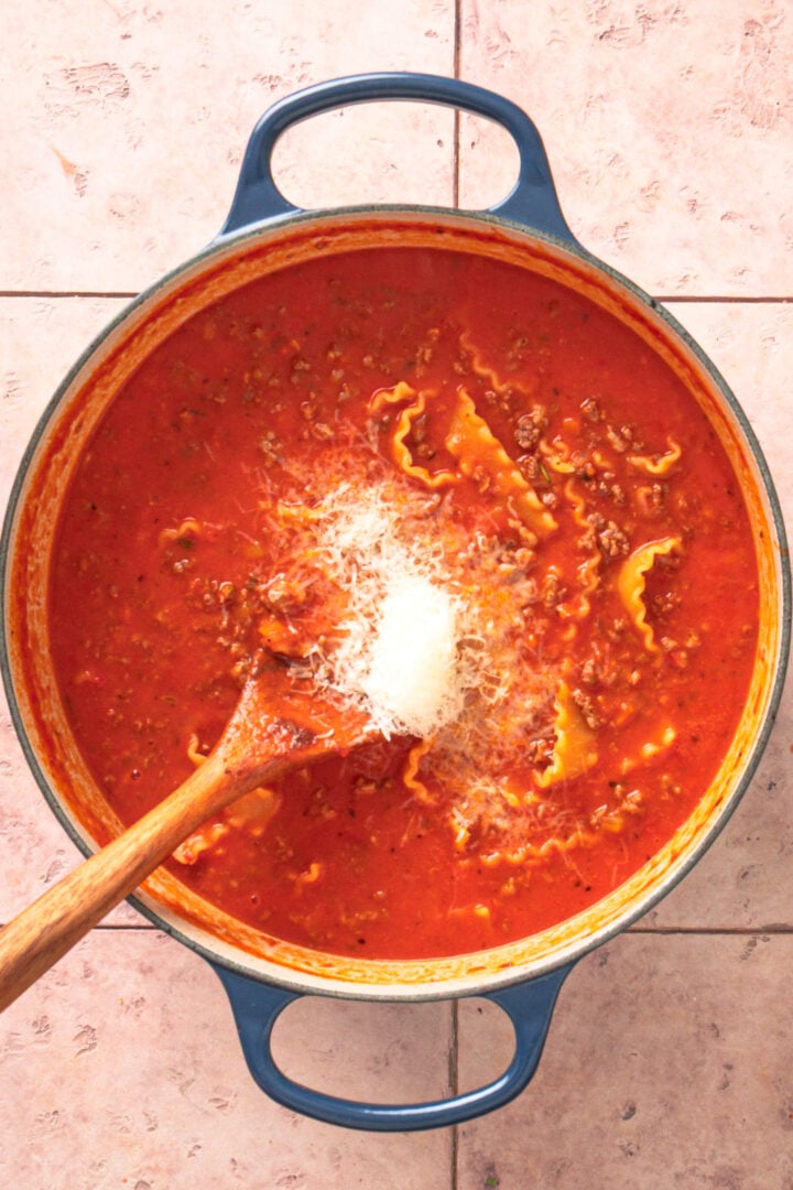 Grated Parmesan melting into creamy lasagna soup