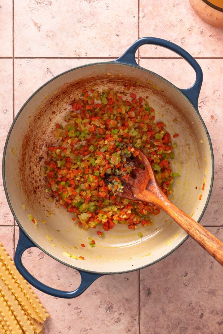 Onion, carrot, and celery cooking in pot until softened