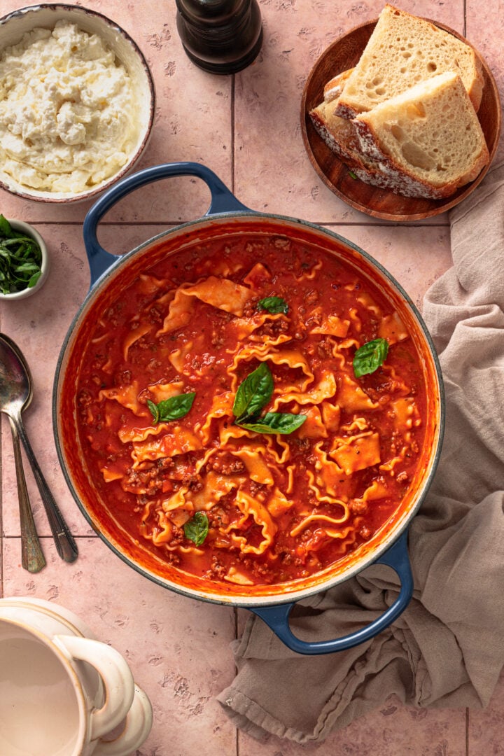One pot creamy lasagna soup with pasta and meat sauce in Dutch oven.