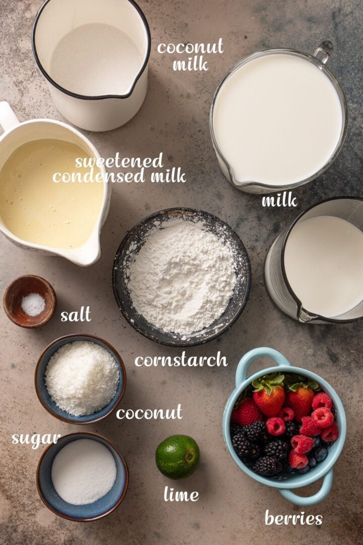 Ingredients for Brazilian coconut flan with berry sauce, including milk, coconut milk, sweetened condensed milk, cornstarch, sugar, coconut, lime, and mixed berries.